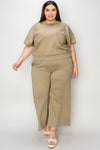 Textured, stretchy, and comfy. This two piece cropped pant with short sleeve top is a great travel set to stay comfortable in the car or plane. Available in a variety of colors and extended sizes.