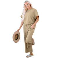 Textured, stretchy, and comfy. This two piece cropped pant with short sleeve top is a great travel set to stay comfortable in the car or plane. Available in a variety of colors and extended sizes.