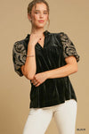 Woman wearing Velvet Embroidered Sleeve Blouse-This velvet embroidered sleeve blouse combines luxe velvet with embroidery for a sophisticated and stylish look. Perfect for adding a touch of glamour to your outfit.