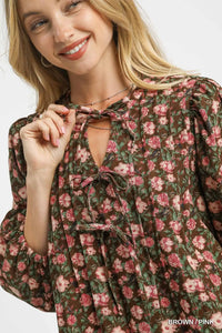Woman wearing Fall Floral Tie-Neck Babydoll Dress-Fall floral tie-neck babydoll dress is a charming choice for any occasion. The tie-neck detail adds a touch of elegance to the sweet babydoll silhouette.