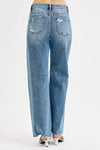 Woman wearing Relaxed Fit Wide Baggy Leg Washed Jeans-Mid-rise relaxed fit, wide baggy leg jeans feature a tie-washed design, slightly distressed for a cool and edgy aesthetic - for creating a casual trendy outfit.