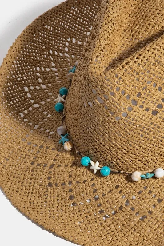 Woman wearing Turquoise & Shell Star Beads Strap Western Straw Hat-Western-style straw hat with turquoise and shell star beads. Lightweight, boho-chic, and perfect for festivals, beach days, or sunny adventures.