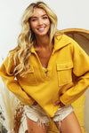 Woman wearing Honey Mustard Fleece Collared Sweatshirt-Fleece collared sweatshirt with flap pockets and button details. Cozy, stylish, and perfect for layering all season long, your new cozy fall favorite.