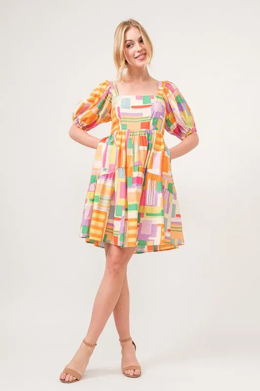 Square Neck Puff Sleeve Geo Printed Mini Dress-The square neck puff sleeve geo printed mini dress is a fashionable and eye-catching choice for a stylish ensemble. The square neckline adds a modern and chic touch-Reef Love Boho-Chic Boutique