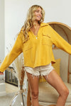 Woman wearing Honey Mustard Fleece Collared Sweatshirt-Fleece collared sweatshirt with flap pockets and button details. Cozy, stylish, and perfect for layering all season long, your new cozy fall favorite.
