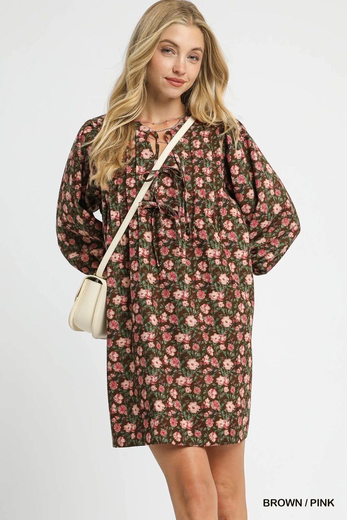 Woman wearing Fall Floral Tie-Neck Babydoll Dress-Fall floral tie-neck babydoll dress is a charming choice for any occasion. The tie-neck detail adds a touch of elegance to the sweet babydoll silhouette.