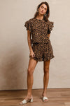 Woman wearing Leopard Print Waffle Texture Layered Ruffle Sleeve Top and Shorts Set-This leopard print set features a leopard print waffle texture top with layered ruffle sleeves, paired with matching shorts for a coordinated and stylish look. 