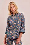 Shop Washed Floral Print Denim Shacket-This Washed Floral Print Denim Shacket features a relaxed oversized fit, button front, and vintage floral wash. Pair with wide leg jeans to complete the look.-Reef Love Boho-Chic Boutique