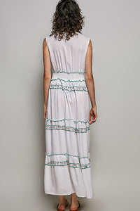 Ivory leafy floral tiered maxi dress with smocked waistband, shirred ruffles, and contrast merrow edges.