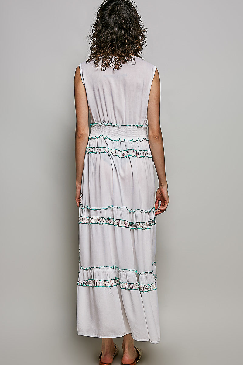 Ivory leafy floral tiered maxi dress with smocked waistband, shirred ruffles, and contrast merrow edges.