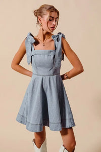 A Line Fit and Flare Diamond Bow Ribbon Denim Dres-This A-line fit and flare diamond bow ribbon denim dress is a charming and stylish choice for a variety of occasions. The fit and flare silhouette is flattering and versatile-Reef Love Boho-Chic Boutique