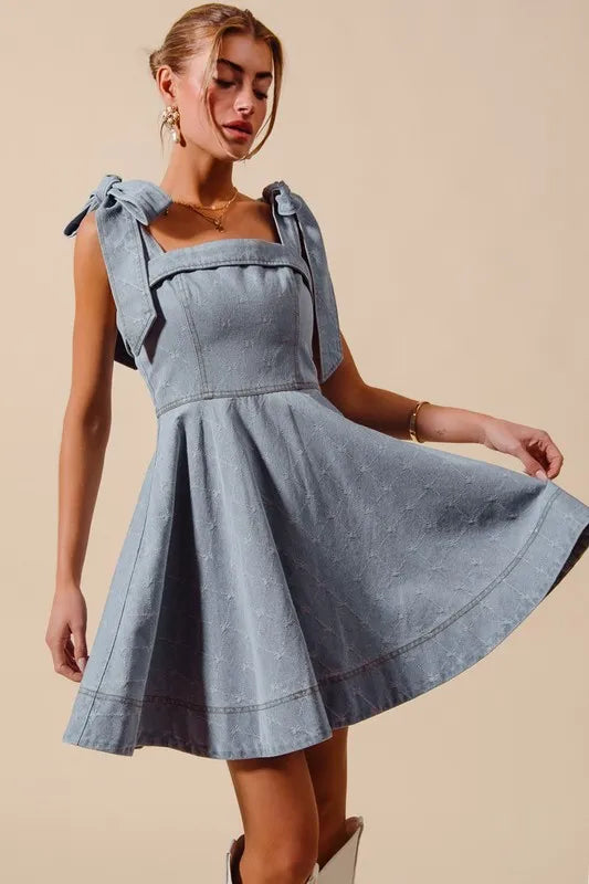 A Line Fit and Flare Diamond Bow Ribbon Denim Dres-This A-line fit and flare diamond bow ribbon denim dress is a charming and stylish choice for a variety of occasions. The fit and flare silhouette is flattering and versatile-Reef Love Boho-Chic Boutique
