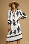 Abstract Medallion Print Midi Dress-Turn heads with this abstract medallion print midi dress featuring a modern black-on-off-white design, soft stretch fabric, and versatile styling for any occasion.-Reef Love Boho-Chic Boutique