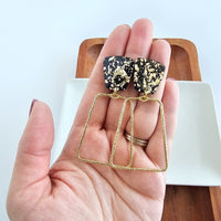 Shop Ariana Earrings - Black Gold Flake-Ariana Earrings in black with gold flake feature lightweight acrylic studs and bold gold charms. Hypoallergenic, luxe, and perfect for day-to-night styling.-available at Reef Love online boho-chic boutique