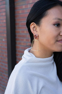 Shop Ariana Earrings - Rust-Ariana Earrings in rust pair earthy acrylic studs with gold trapezoid charms. Lightweight, hypoallergenic, and bold—perfect for everyday boho-chic styling.-available at Reef Love online boho-chic boutique