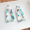 Shop Avery Spring Fling Drop Earrings-Avery Spring Fling Drop Earrings with confetti acrylic charms in cool blue and teal tones. Lightweight and fresh—perfect for spring days and breezy outfits.-available at Reef Love online boho-chic boutique