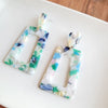 Shop Avery Spring Fling Drop Earrings-Avery Spring Fling Drop Earrings with confetti acrylic charms in cool blue and teal tones. Lightweight and fresh—perfect for spring days and breezy outfits.-available at Reef Love online boho-chic boutique