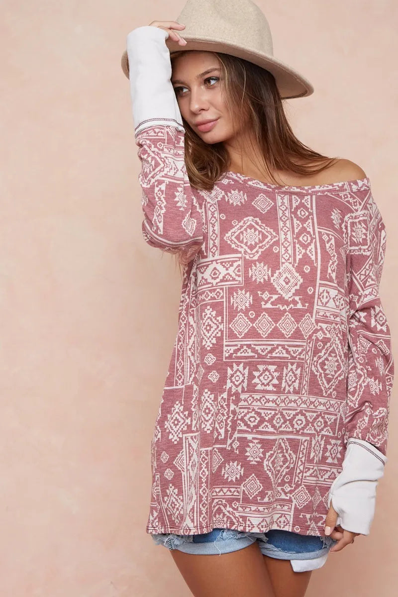Aztec Print French Terry Top-Aztec print French terry top with thumb opening is a stylish and functional choice for your casual wardrobe. The Aztec print adds a vibrant, eye-catching touch.