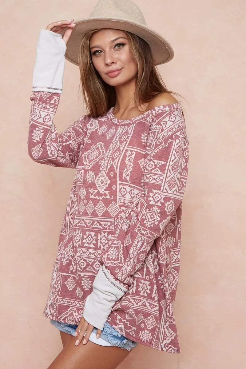 Aztec Print French Terry Top-Aztec print French terry top with thumb opening is a stylish and functional choice for your casual wardrobe. The Aztec print adds a vibrant, eye-catching touch.