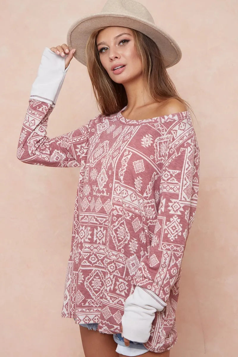 Aztec Print French Terry Top-Aztec print French terry top with thumb opening is a stylish and functional choice for your casual wardrobe. The Aztec print adds a vibrant, eye-catching touch.
