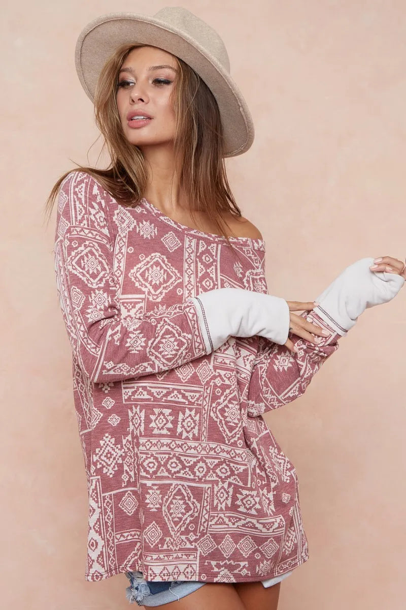 Aztec Print French Terry Top-Aztec print French terry top with thumb opening is a stylish and functional choice for your casual wardrobe. The Aztec print adds a vibrant, eye-catching touch.