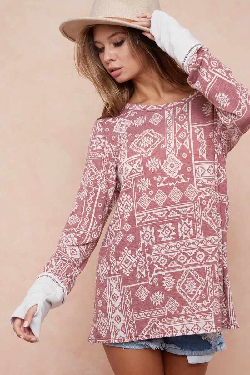 Aztec Print French Terry Top-Aztec print French terry top with thumb opening is a stylish and functional choice for your casual wardrobe. The Aztec print adds a vibrant, eye-catching touch.