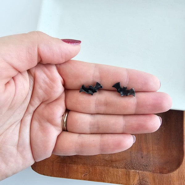 Shop Bat Studs - Black-Black bat stud earrings made from lightweight acrylic with hypoallergenic posts. The perfect spooky accessory for Halloween or fun everyday gothic style.-available at Reef Love online boho-chic boutique