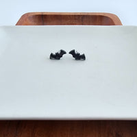 Shop Bat Studs - Black-Black bat stud earrings made from lightweight acrylic with hypoallergenic posts. The perfect spooky accessory for Halloween or fun everyday gothic style.-available at Reef Love online boho-chic boutique