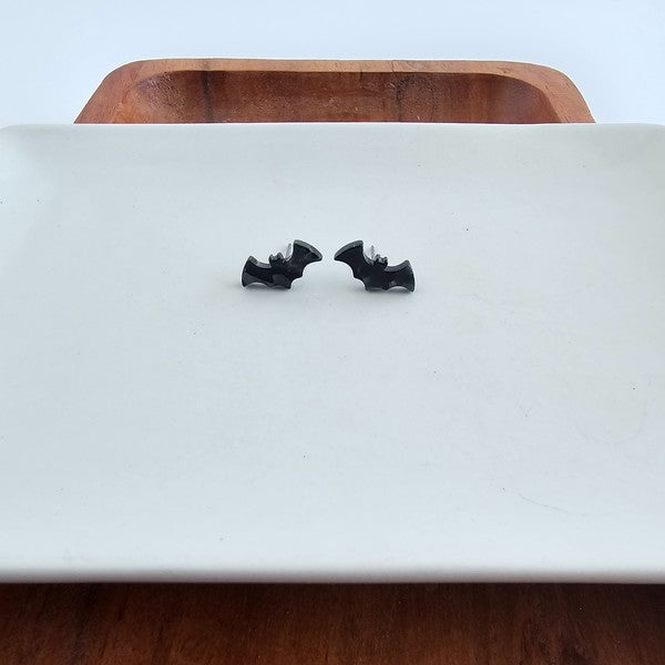 Shop Bat Studs - Black-Black bat stud earrings made from lightweight acrylic with hypoallergenic posts. The perfect spooky accessory for Halloween or fun everyday gothic style.-available at Reef Love online boho-chic boutique