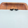 Shop Bat Studs - Black-Black bat stud earrings made from lightweight acrylic with hypoallergenic posts. The perfect spooky accessory for Halloween or fun everyday gothic style.-available at Reef Love online boho-chic boutique