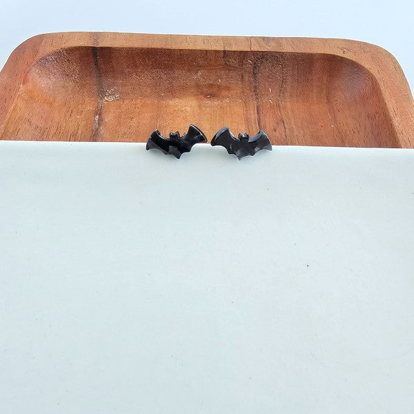 Shop Bat Studs - Black-Black bat stud earrings made from lightweight acrylic with hypoallergenic posts. The perfect spooky accessory for Halloween or fun everyday gothic style.-available at Reef Love online boho-chic boutique