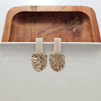 Shop Belize Earrings - Gold Monstera-Lightweight gold monstera leaf earrings with shimmery neutral acrylic studs. Tropical-inspired and hypoallergenic—perfect for everyday or resort-ready style.-available at Reef Love online boho-chic boutique