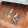 Shop Belize Earrings - Gold Monstera-Lightweight gold monstera leaf earrings with shimmery neutral acrylic studs. Tropical-inspired and hypoallergenic—perfect for everyday or resort-ready style.-available at Reef Love online boho-chic boutique