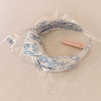 Blue And White Toile Knotted Headband-Blue And White Toile Knotted Headband Made from silky satin fabric, this headband features a classic blue and white toile print and a stylish knotted center detail.