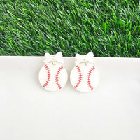 Bow Baseball Earrings-Hit your game day look out of the park with our Game Day Bow Baseball Earrings! Featuring a sweet white bow and a sparkly red-stitched baseball charm.
