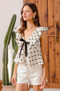 Bow Texture Jacquard Woven Blouse-Black and white jacquard woven blouse with bow tie, scallop trim, and V-neckline. Elegant fitted top for chic workwear or polished casual looks.-Reef Love