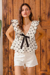 Bow Texture Jacquard Woven Blouse-Black and white jacquard woven blouse with bow tie, scallop trim, and V-neckline. Elegant fitted top for chic workwear or polished casual looks.-Reef Love