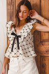 Bow Texture Jacquard Woven Blouse-Black and white jacquard woven blouse with bow tie, scallop trim, and V-neckline. Elegant fitted top for chic workwear or polished casual looks.-Reef Love