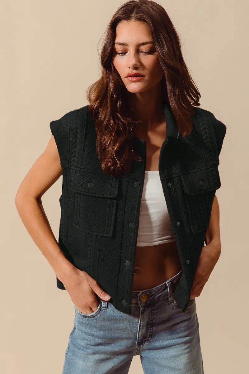 Shop Cable Quilting Stitch Button Up Knit Vest-Elevate your fall layers with our cable quilting stitch button-up knit vest. Featuring textured cable knit, functional pockets, and a structured silhouette perfect for layering.-available at Reef Love online boho-chic boutique