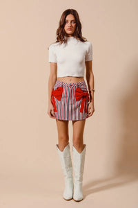 Contrast Bow Knot Pocket Fourth Of July Denim Skirt-Red & white striped denim mini skirt with bow knot detail & pockets. High-waisted & lightweight for summer fun—perfect for Fourth of July & casual styling.-Reef Love Boho-Chic Boutique