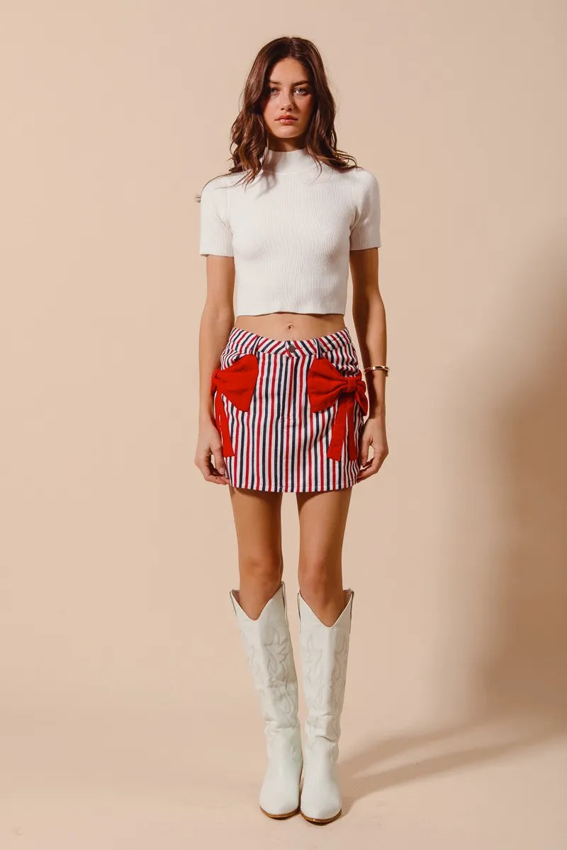 Contrast Bow Knot Pocket Fourth Of July Denim Skirt-Red & white striped denim mini skirt with bow knot detail & pockets. High-waisted & lightweight for summer fun—perfect for Fourth of July & casual styling.-Reef Love Boho-Chic Boutique