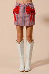 Contrast Bow Knot Pocket Fourth Of July Denim Skirt-Red & white striped denim mini skirt with bow knot detail & pockets. High-waisted & lightweight for summer fun—perfect for Fourth of July & casual styling.-Reef Love Boho-Chic Boutique
