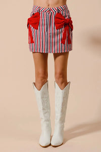 Contrast Bow Knot Pocket Fourth Of July Denim Skirt-Red & white striped denim mini skirt with bow knot detail & pockets. High-waisted & lightweight for summer fun—perfect for Fourth of July & casual styling.-Reef Love Boho-Chic Boutique