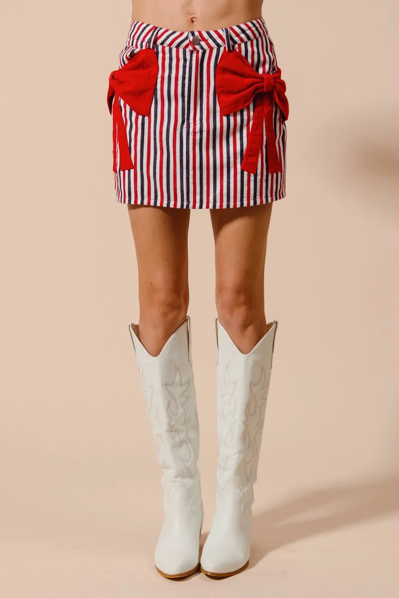 Contrast Bow Knot Pocket Fourth Of July Denim Skirt-Red & white striped denim mini skirt with bow knot detail & pockets. High-waisted & lightweight for summer fun—perfect for Fourth of July & casual styling.-Reef Love Boho-Chic Boutique