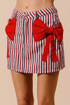 Contrast Bow Knot Pocket Fourth Of July Denim Skirt-Red & white striped denim mini skirt with bow knot detail & pockets. High-waisted & lightweight for summer fun—perfect for Fourth of July & casual styling.-Reef Love Boho-Chic Boutique