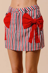 Contrast Bow Knot Pocket Fourth Of July Denim Skirt-Red & white striped denim mini skirt with bow knot detail & pockets. High-waisted & lightweight for summer fun—perfect for Fourth of July & casual styling.-Reef Love Boho-Chic Boutique