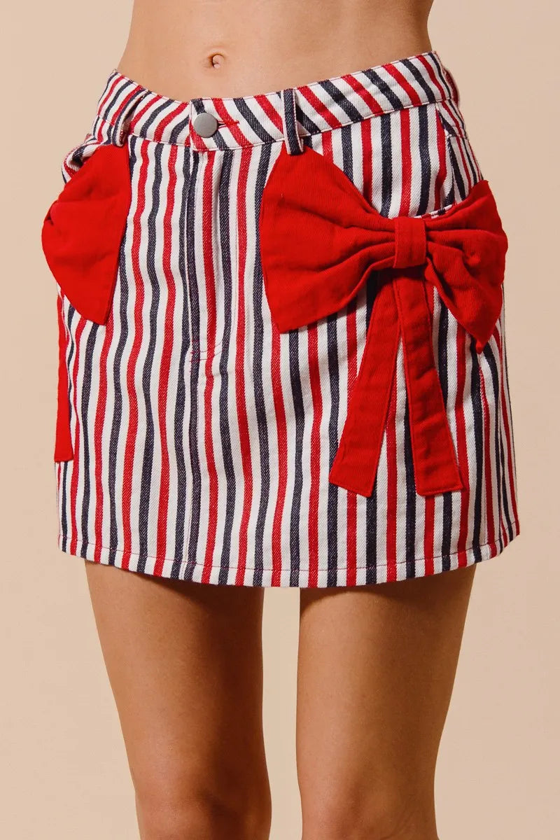 Contrast Bow Knot Pocket Fourth Of July Denim Skirt-Red & white striped denim mini skirt with bow knot detail & pockets. High-waisted & lightweight for summer fun—perfect for Fourth of July & casual styling.-Reef Love Boho-Chic Boutique