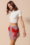 Contrast Bow Knot Pocket Fourth Of July Denim Skirt-Red & white striped denim mini skirt with bow knot detail & pockets. High-waisted & lightweight for summer fun—perfect for Fourth of July & casual styling.-Reef Love Boho-Chic Boutique