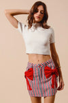Contrast Bow Knot Pocket Fourth Of July Denim Skirt-Red & white striped denim mini skirt with bow knot detail & pockets. High-waisted & lightweight for summer fun—perfect for Fourth of July & casual styling.-Reef Love Boho-Chic Boutique