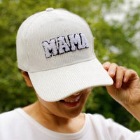 Corduroy Mama Baseball Cap-Adorable corduroy MAMA ball cap with fuzzy patch lettering. Has great fit with perfect curved brim. Clip closure on the back to adjust size and hidden pocket.